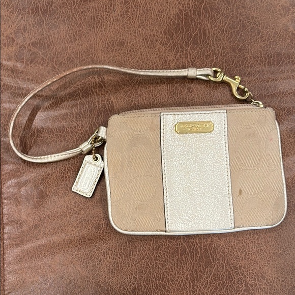 Coach Handbags - Coach Tan Gold Wristlet Clutch Sleek Design